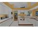Modern kitchen with white cabinetry, ample counter space, and stainless appliances, perfect for the home chef at 850 Van Gogh Road, Englewood, FL 34223