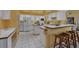 Bright, spacious kitchen with updated appliances and a cozy breakfast bar for casual dining at 850 Van Gogh Road, Englewood, FL 34223