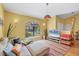 Relaxing living room with a comfortable sofa, modern decor, and ample natural light at 850 Van Gogh Road, Englewood, FL 34223