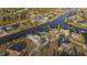 Aerial view of home on a canal with a private dock and waterfront access at 9214 Melody Cir, Port Charlotte, FL 33981