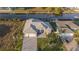 Aerial view of a beautiful waterfront home with a private dock and lush landscaping at 9214 Melody Cir, Port Charlotte, FL 33981
