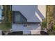 Aerial view of a dock and patio on a canal with a screened-in pool at 9214 Melody Cir, Port Charlotte, FL 33981