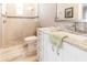 A pristine bathroom features a shower with mosaic tile accents and a granite-topped vanity at 9214 Melody Cir, Port Charlotte, FL 33981
