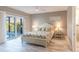 Bright bedroom featuring a sliding glass door to the pool and waterfront views at 9214 Melody Cir, Port Charlotte, FL 33981