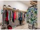 A spacious walk-in closet with wooden shelving and ample storage space at 9214 Melody Cir, Port Charlotte, FL 33981