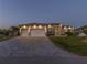 Beautiful single-story home with stone accents and a three-car garage at 9214 Melody Cir, Port Charlotte, FL 33981