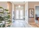 Bright foyer with double doors, wood floors, decorative art, and contemporary decor at 9214 Melody Cir, Port Charlotte, FL 33981