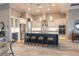 Elegant kitchen with a navy island, stainless steel appliances, pendant lighting, and ample cabinet space at 9214 Melody Cir, Port Charlotte, FL 33981