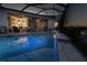 A private outdoor pool and screened-in patio with view of the interior living area at 9214 Melody Cir, Port Charlotte, FL 33981