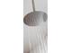 Modern rain shower head pouring water in bathroom at 9214 Melody Cir, Port Charlotte, FL 33981