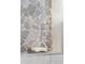 Shower showcasing unique and natural stone-patterned tiles, complemented by a built-in shelf with bar soap at 9214 Melody Cir, Port Charlotte, FL 33981