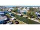This aerial view showcases canal front home with boat lifts, lush landscaping, and proximity to waterways at 9230 Pine Cove Dr, Englewood, FL 34224