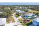 An aerial view of a lovely home featuring beautiful landscaping, and an inviting pool area with plenty of space at 9230 Pine Cove Dr, Englewood, FL 34224