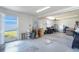 Spacious garage with ample storage, work area, and convenient exterior access at 9230 Pine Cove Dr, Englewood, FL 34224