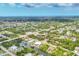 Neighborhood aerial view of single Gathering homes along canals and residential streets in a planned community at 9283 Impala Cir, Port Charlotte, FL 33981