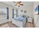 Bedroom featuring two large windows letting in light, a white bed, and matching white nightstands at 9283 Impala Cir, Port Charlotte, FL 33981