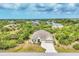 Well maintained single Gathering home with landscaped front yard, long driveway, and attached two car garage at 9283 Impala Cir, Port Charlotte, FL 33981