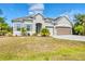 Attractive single-Gathering home featuring tidy landscaping, and a spacious two-car garage at 9283 Impala Cir, Port Charlotte, FL 33981