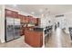 Stylish kitchen featuring a large island, stainless steel appliances, and tile flooring at 9283 Impala Cir, Port Charlotte, FL 33981