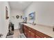 This laundry room features a utility sink, built-in cabinets for storage, and washer and dryer at 9283 Impala Cir, Port Charlotte, FL 33981