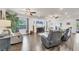 Spacious living room featuring hardwood floors, large windows, recessed lighting, and modern decor at 9283 Impala Cir, Port Charlotte, FL 33981