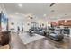Spacious living room with hardwood floors, ceiling fan, and view into the kitchen at 9283 Impala Cir, Port Charlotte, FL 33981