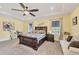 The spacious main bedroom offers a tray ceiling, carpet, and large windows allowing for plenty of natural light at 9283 Impala Cir, Port Charlotte, FL 33981