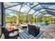 Lanai with a pool, fire pit, and lounge seating, perfect for outdoor entertaining at 9283 Impala Cir, Port Charlotte, FL 33981