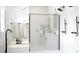 Bright bathroom featuring marble walls, modern fixtures, and a freestanding tub for a spa-like experience at Lot 17 Blk 257 Omela Terrace, North Port, FL 34286