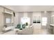 Open-concept living room showcases a comfortable sofa, modern decor, and ample natural light at Lot 18 Blk 284 Wooley Ave, North Port, FL 34287
