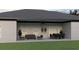 Spacious back porch with ceiling fan, sliding glass doors and outdoor dining and lounging furniture at Lot 8 Blk 285 Houston Ln, North Port, FL 34287