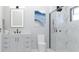 Contemporary bathroom featuring a sleek vanity, illuminated mirror, and glass-enclosed shower at Lot 8 Blk 285 Houston Ln, North Port, FL 34287