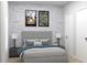 Stylish bedroom with muted gray tones, urban-themed wall art, and comfortable furnishings at Lot 8 Blk 285 Houston Ln, North Port, FL 34287
