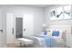 This bedroom has a white accent wall, plush bedding, and decorative artwork at Lot14 Blk285 Houston Ln, North Port, FL 34287