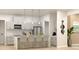 Modern kitchen featuring stainless steel appliances, gray cabinets, and a marble island with barstool seating at Lot14 Blk285 Houston Ln, North Port, FL 34287