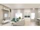 Bright, open-concept living area with large windows, modern decor, and stylish furniture at Lot14 Blk285 Houston Ln, North Port, FL 34287