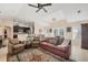 Open-concept living room with direct access to the kitchen and views to the exterior patio at 10039 Sunday Dr, Port Charlotte, FL 33981