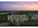 Stunning aerial view of the condo complex, golf course, and waterfront at 10055 Links Ln # 402, Rotonda West, FL 33947