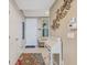 Inviting entryway featuring tile floors, a stylish desk, and tasteful decor at 10055 Links Ln # 402, Rotonda West, FL 33947