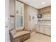 Entryway with custom bench and built in storage, with tile floors at 10055 Links Ln # 402, Rotonda West, FL 33947