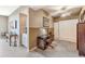 Cozy office space with carpeted floors, a desk, and built-in storage at 10055 Links Ln # 402, Rotonda West, FL 33947