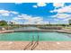 Inviting community pool with lake views, perfect for relaxation and enjoyment at 10055 Links Ln # 402, Rotonda West, FL 33947