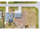 Aerial view showing the home and the screened pool at 10060 Amelia Ave, Englewood, FL 34224