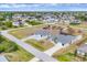 Beautiful aerial view of neighborhood homes with lush landscaping and a community featuring a pool at 10060 Amelia Ave, Englewood, FL 34224
