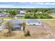 Aerial view showcasing the home, backyard, and screened pool area at 10060 Amelia Ave, Englewood, FL 34224