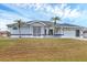 Attractive single-Gathering home boasting an attached two-car garage and a well-kept front lawn at 10060 Amelia Ave, Englewood, FL 34224