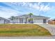 Charming single-Gathering home featuring a two-car garage and a well-maintained lawn at 10060 Amelia Ave, Englewood, FL 34224