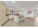Spacious kitchen with an island, white appliances, tile flooring, and lots of cabinets at 10060 Amelia Ave, Englewood, FL 34224