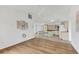 Spacious layout featuring hardwood floors connecting the living area and kitchen at 10060 Amelia Ave, Englewood, FL 34224