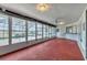 Large sun room featuring lots of natural light, a ceiling fan, and a bar at 10060 Amelia Ave, Englewood, FL 34224